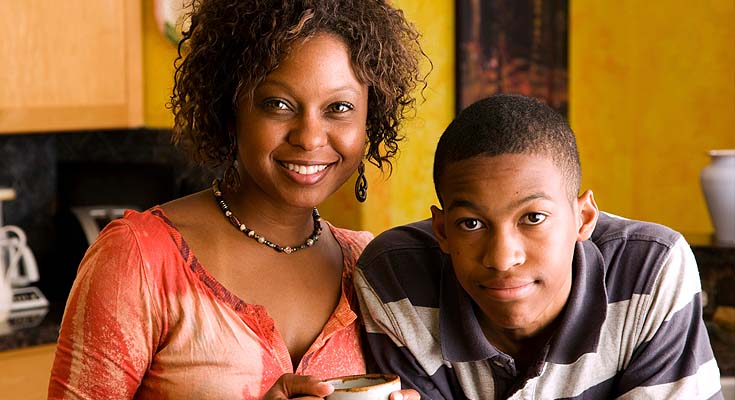 Woman and teenage boy smiling